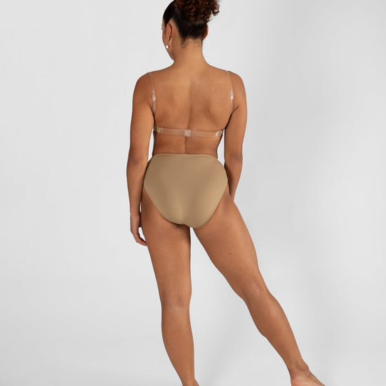 Model wearing a nude high cut dance brief with matching bra, back view