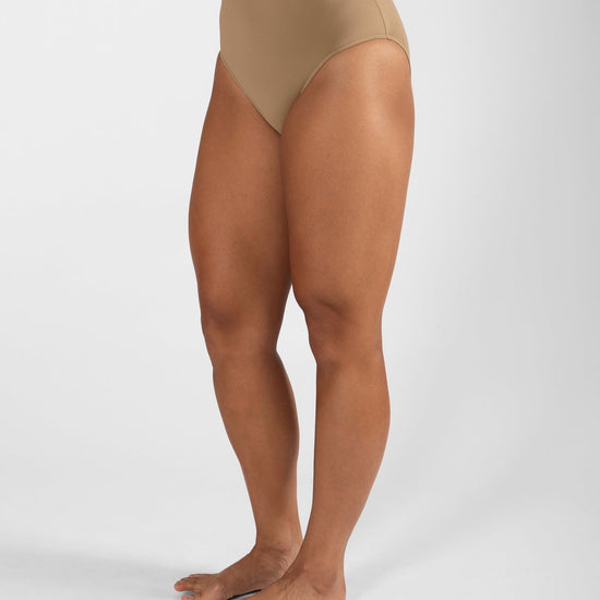 Side close-up of nude high cut dance brief on model