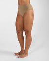 Side close-up of nude high cut dance brief on model