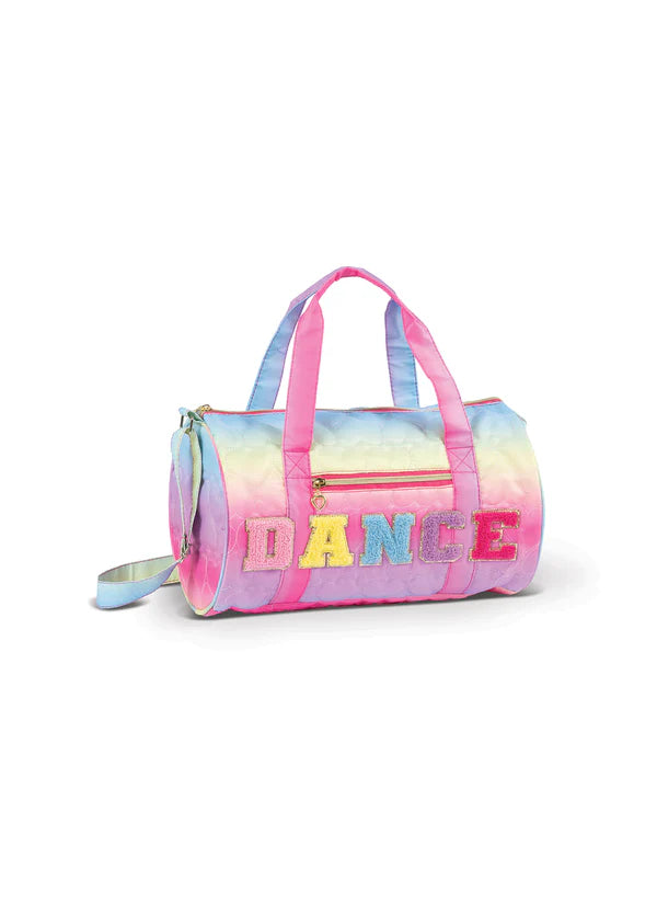 Pastel rainbow quilted dance duffel bag with pink straps and “DANCE” lettering