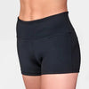 Dancer wearing black high-waisted dance shorts with a smooth waistband and fitted silhouette