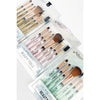 Assorted makeup brush sets in clear packaging with pastel-colored handles