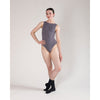 Dancer wearing black dance socks posing in a leotard
