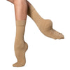 Close-up of dancer wearing tan dance socks showing foot shape
