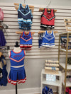 Mini cheer outfits displayed together on a retail wall