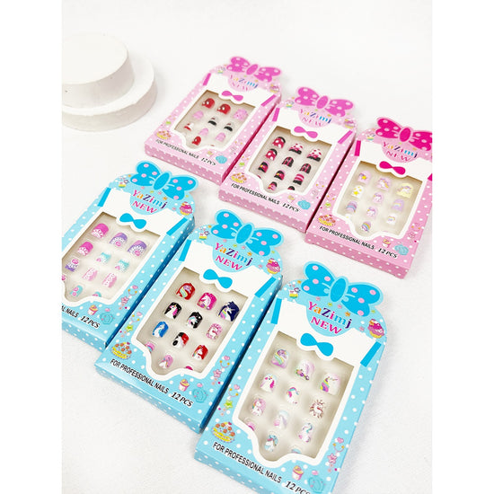 Colorful Love and Repeat kids press-on nail sets displayed in pink and blue packaging
