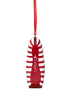 Back view of a red and white striped pointe shoe ornament hanging by a red ribbon.