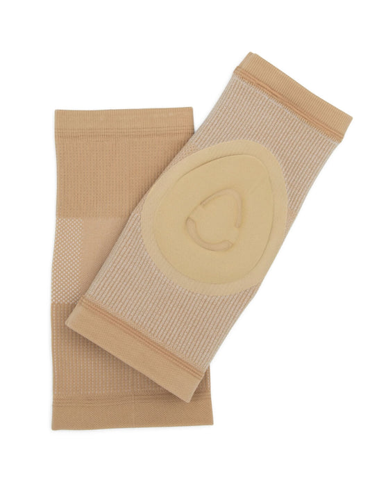 Pair of nude gel dance kneepads laid flat on a white background.