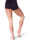 Nude gel dance kneepad worn on one leg from the back view.