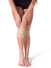 Nude gel dance kneepads worn on both knees against a white background.