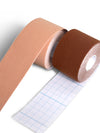 Roll of nude kinesiology tape partially unrolled with grid backing visible