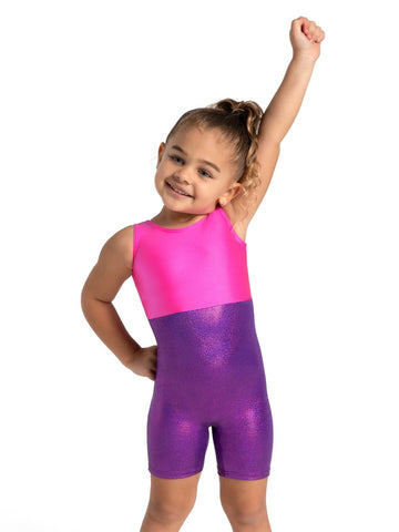 Child wearing pink and purple sparkly biketard front view with arm raised