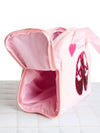 Side view of a pink Capezio tote bag showing its structured shape and depth.