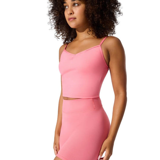 Side view of dancer wearing Flamingo pink pinched front camisole