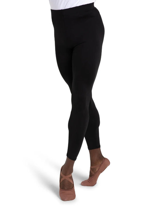 Close-up view of black leggings on a dancer showing fit and length from waist to ankle