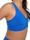 Front view of a blue adult racerback bra top with curved V-neckline