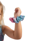 Close-up of matching pastel scrunchie worn on wrist