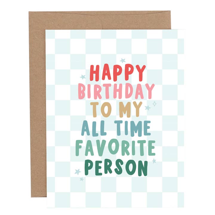 Birthday greeting card with the phrase “Happy Birthday to My All Time Favorite Person” in colorful lettering on a light blue checkered background, shown with a brown envelope.