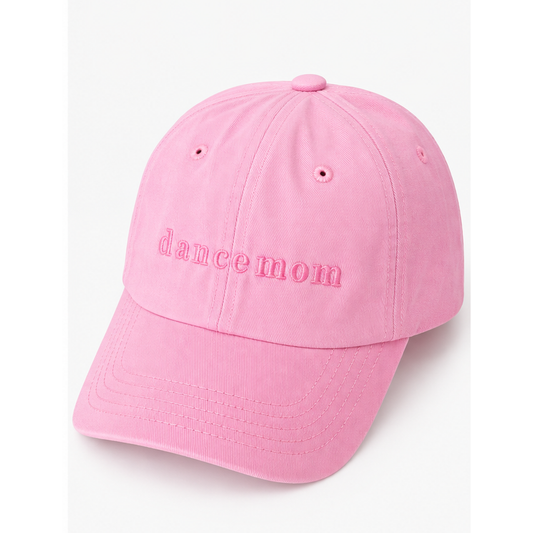 A pink cotton baseball cap with 'dance mom' embroidered in pink script across the front, shown on a clean white background.