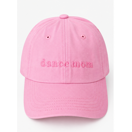 A pink cotton baseball cap with 'dance mom' embroidered in pink on the front, shown against a plain white background.