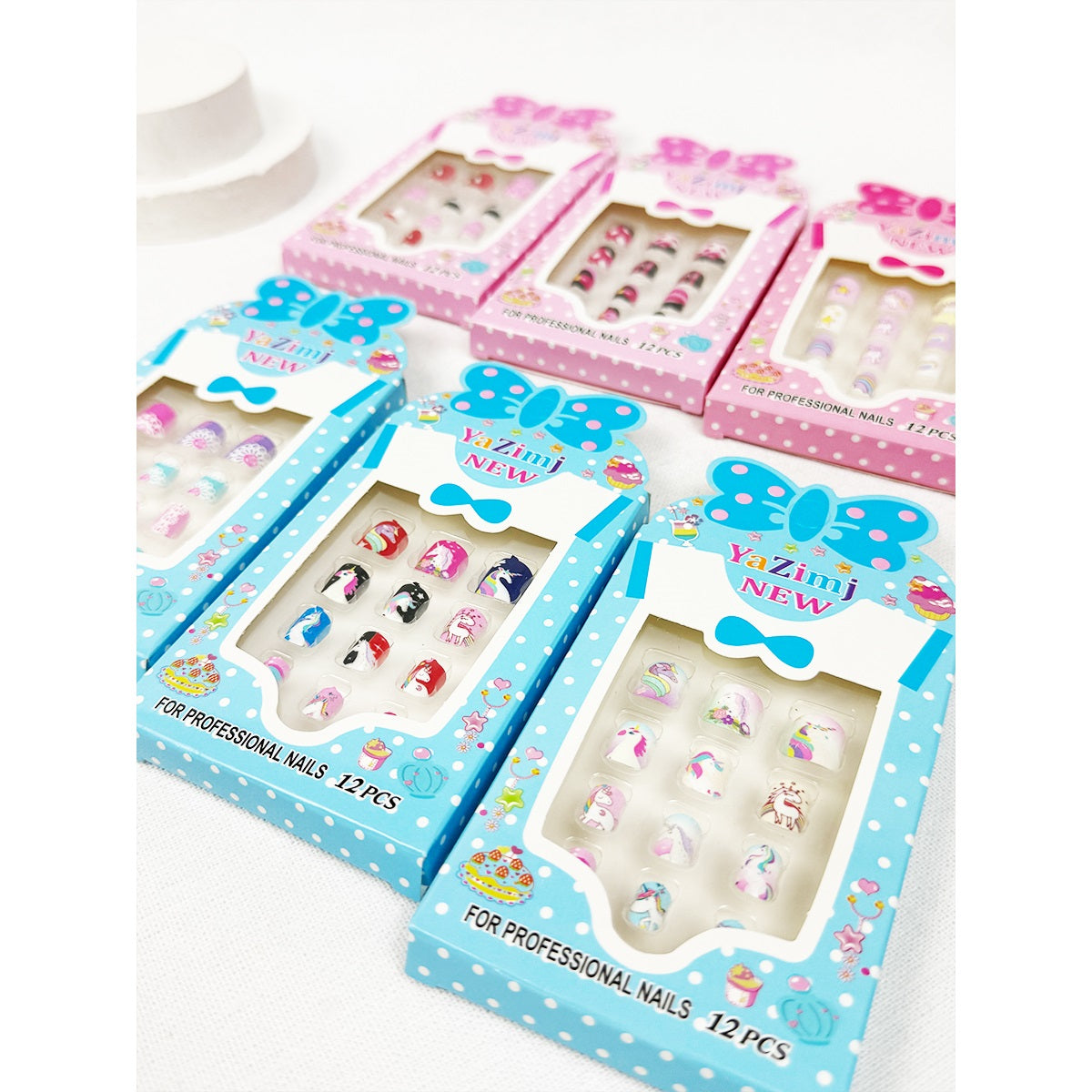 Two blue Love and Repeat kids press-on nail sets with assorted designs