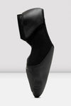 Side profile of a black slip-on leather jazz shoe standing upright.