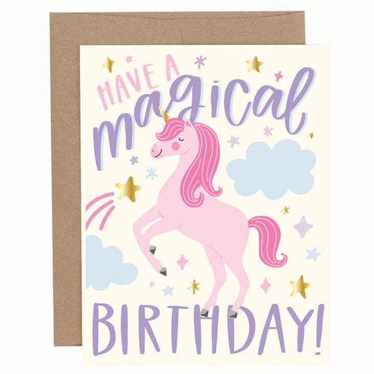Birthday greeting card with a pastel unicorn illustration, clouds, stars, and the phrase “Have a Magical Birthday!” shown with a brown envelope.