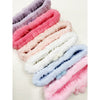 Multiple pastel spa headbands with daisy details displayed together