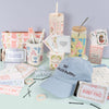 Collection of stationery items including a blue cap, hair accessories, and stationery products on a light green surface.