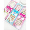 Assorted Love and Repeat kids press-on nail sets arranged in colorful packaging