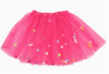 Hot pink children’s tulle tutu featuring bright multi-colored pom pom details between the layers.