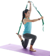 Person using multi-loop stretching strap for leg stretch