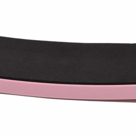 Pink rectangular SpinBoard with black non-slip foot pad for pirouette training.