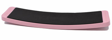 Pink rectangular SpinBoard with black non-slip foot pad for pirouette training.