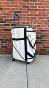 White Glam’r Gear bag shown outdoors against a brick wall