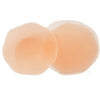 Pair of nude silicone reusable modesty petals shown outside of packaging