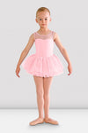 Young dancer wearing a pink tutu leotard with tank straps and mesh neckline, front view