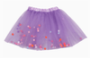 Lavender children’s tulle tutu with colorful pom pom accents for playful dress-up.
