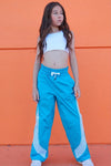 Full-length view of youth dancer wearing blue Jo + Jax Roster Pants