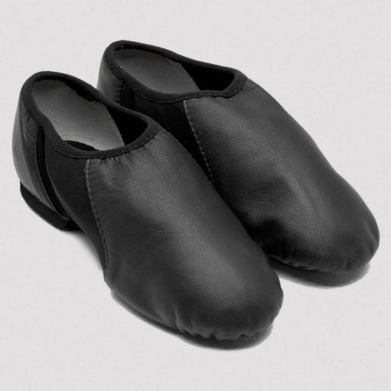 Pair of black slip-on leather jazz shoes on a white background.