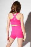 Back view of a pink longline tank showing keyhole back detail