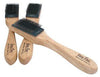Two wooden handle suede sole brushes shown crossed with velcro covers