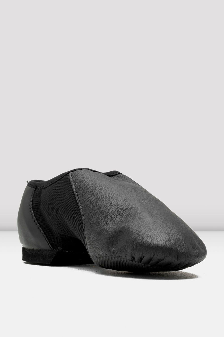 Front angled view of a black slip-on leather jazz shoe on a white background.