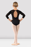 Child wearing black 3/4 sleeve leotard back view showing open back design