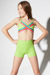 Dancer wearing a lime green crossover dance top paired with matching high-waisted shorts