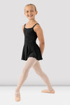 Girl wearing black skirted camisole leotard front view with attached skirt